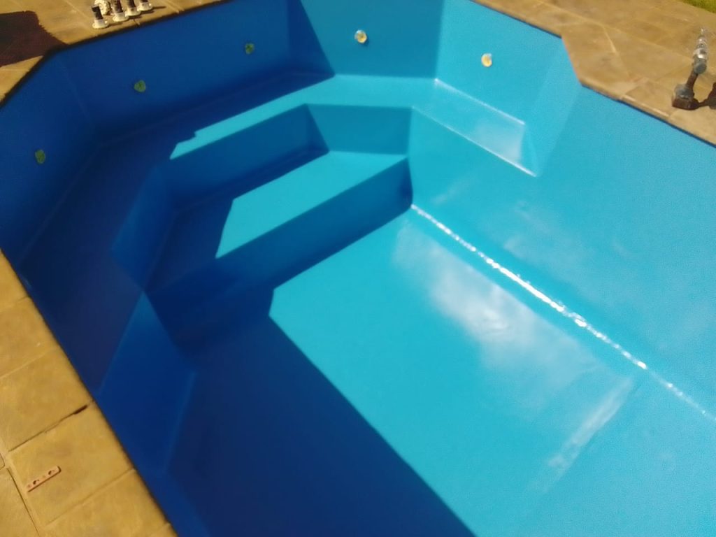 Freshly finished swimming pool showcasing clean surfaces and ready for use