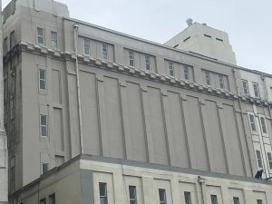 Cleaned and repaired outside wall of a building showing fresh surface and restored condition
