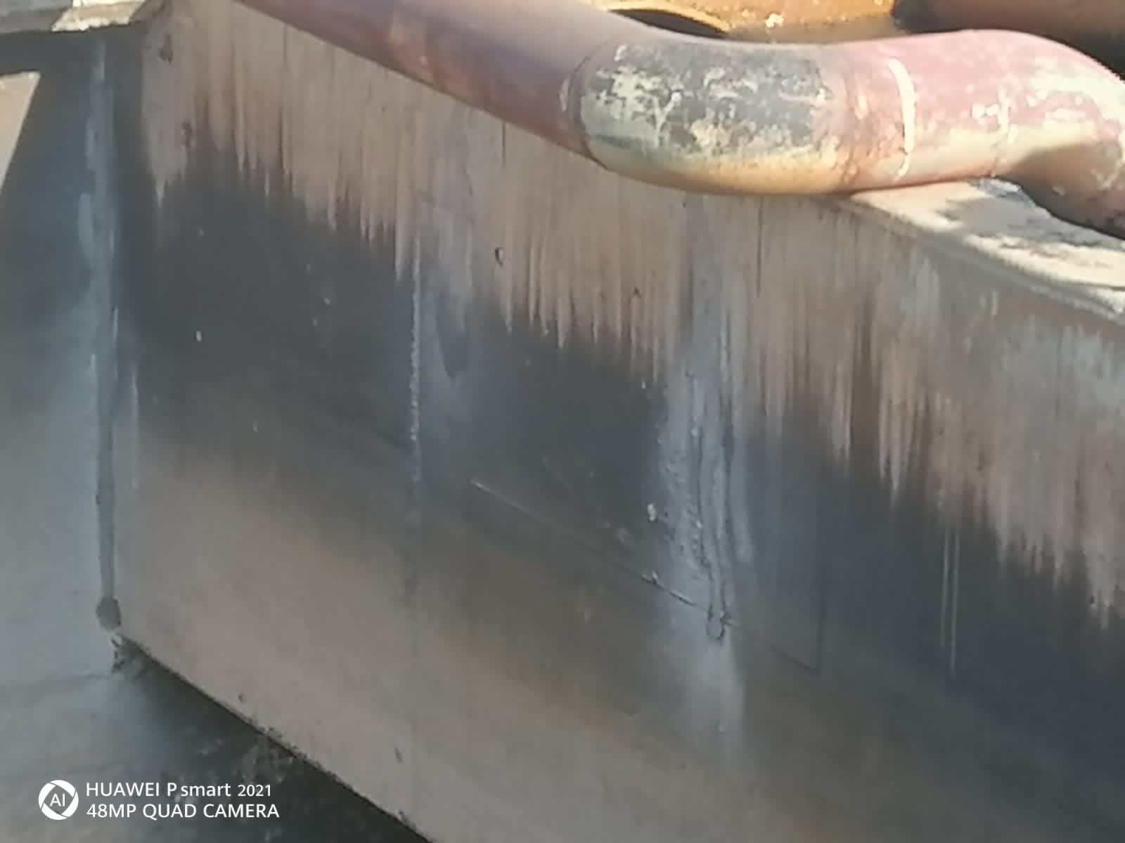 Surface Before Pressure Washing Cleaning Dirty and grimy surface prior to pressure washing, showing accumulated dirt and stains
