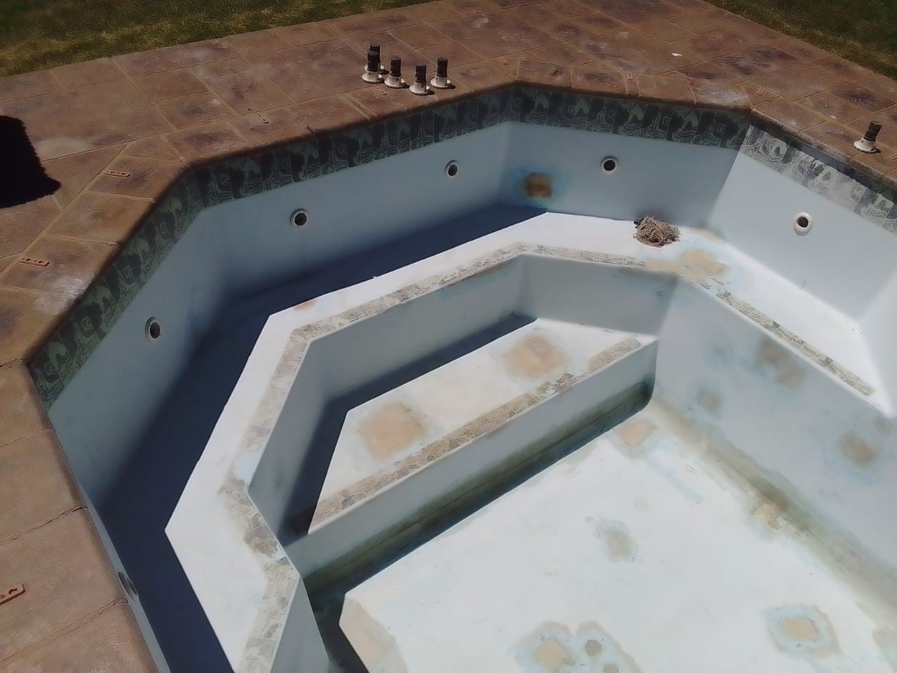 Swimming Pool Before Construction Completion Swimming pool under construction, showing unfinished surfaces and preparation work prior to final completion