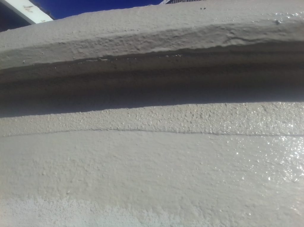Finished drip rim on roof edge, designed to direct water away and protect the structure from water damage