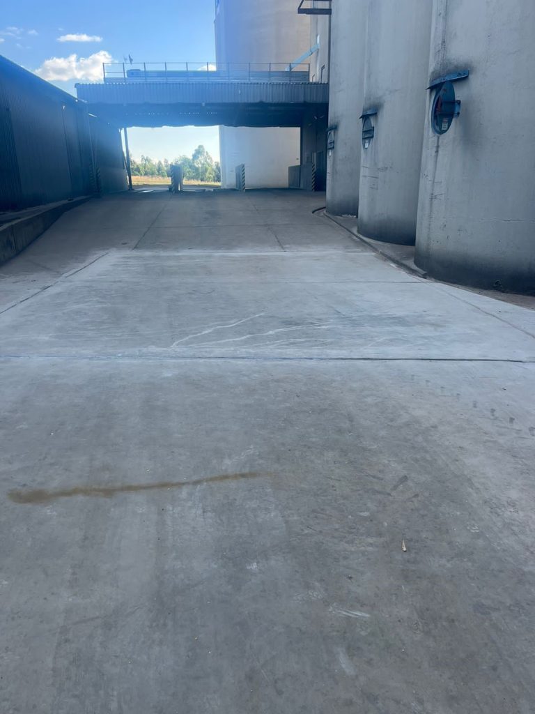 Smooth, freshly finished concrete floor surface after completion, showcasing high-quality workmanship