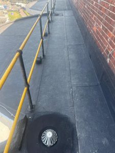 Application of waterproofing membrane on roof surface to prevent water ingress and protect the structure